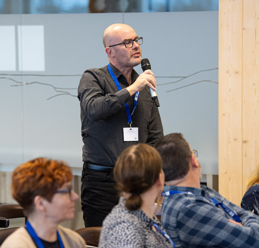 A partner asks a question during an Interreg NPA event
