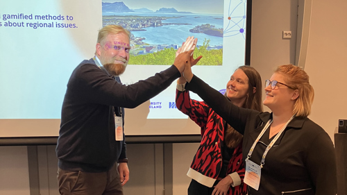InnoGS partners giving each other high fives.