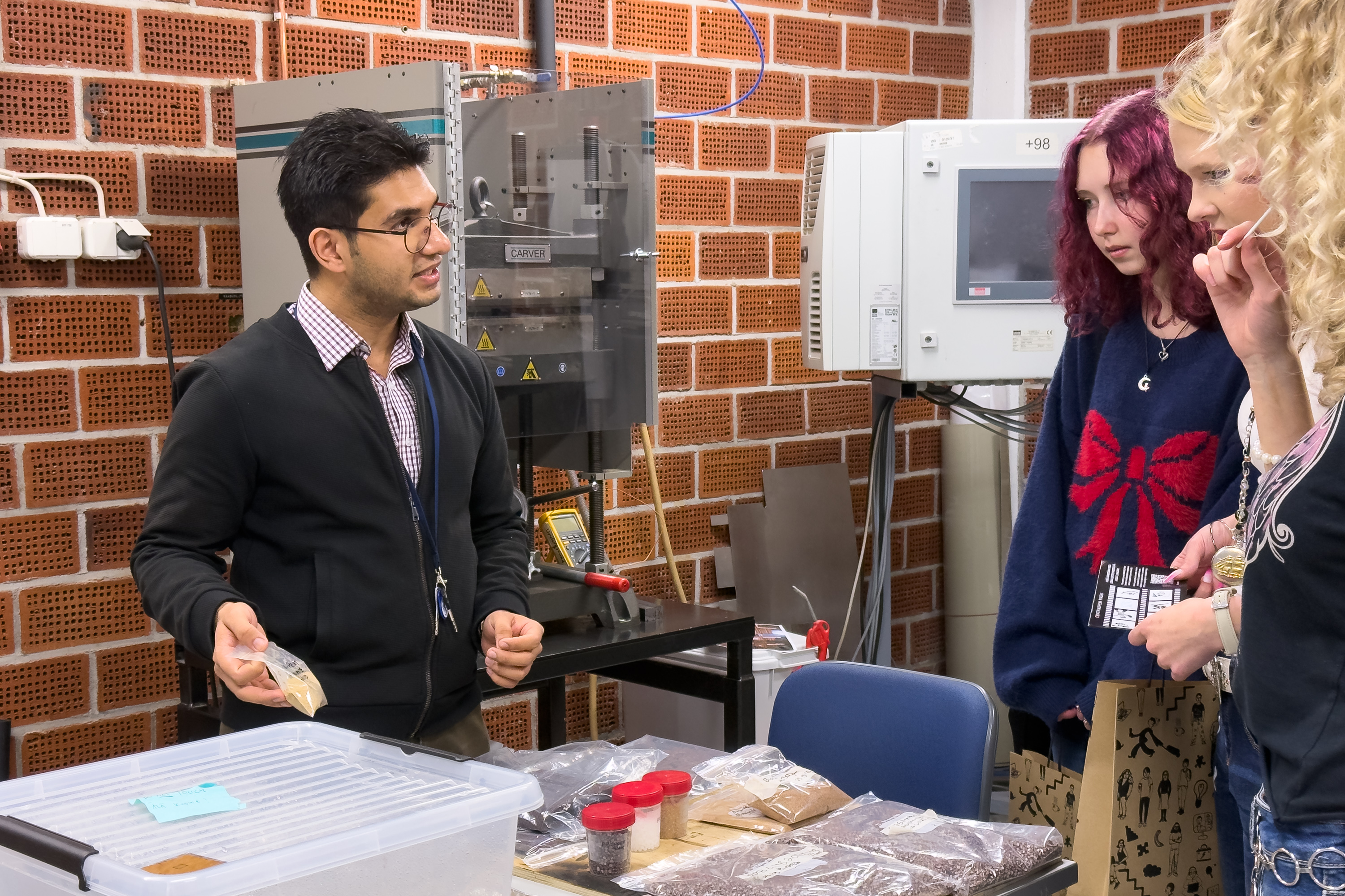 A BIO-2-PRINT project expert presenting samples of natural fibre materials to visitors during Centria Open Doors event.
