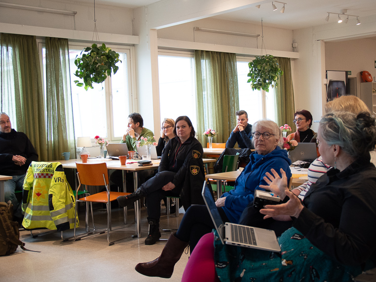 Participants discussing in the audience.