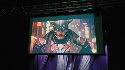 Harald, the leader of the Kuopio resistance movement, gave orders to the players through AI-generated videos.